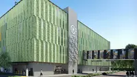 a building with green walls and a sign