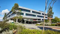 a building with trees and bushes
