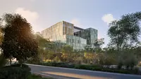 a building with trees and a road