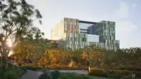 Artist impression of the new hospital building with trees in the foreground