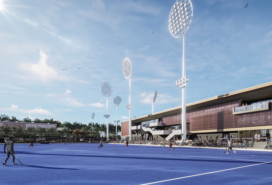 a blue tennis court with many lights on the side