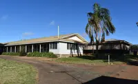 a house with a palm tree in the front