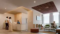 a woman standing in a lobby