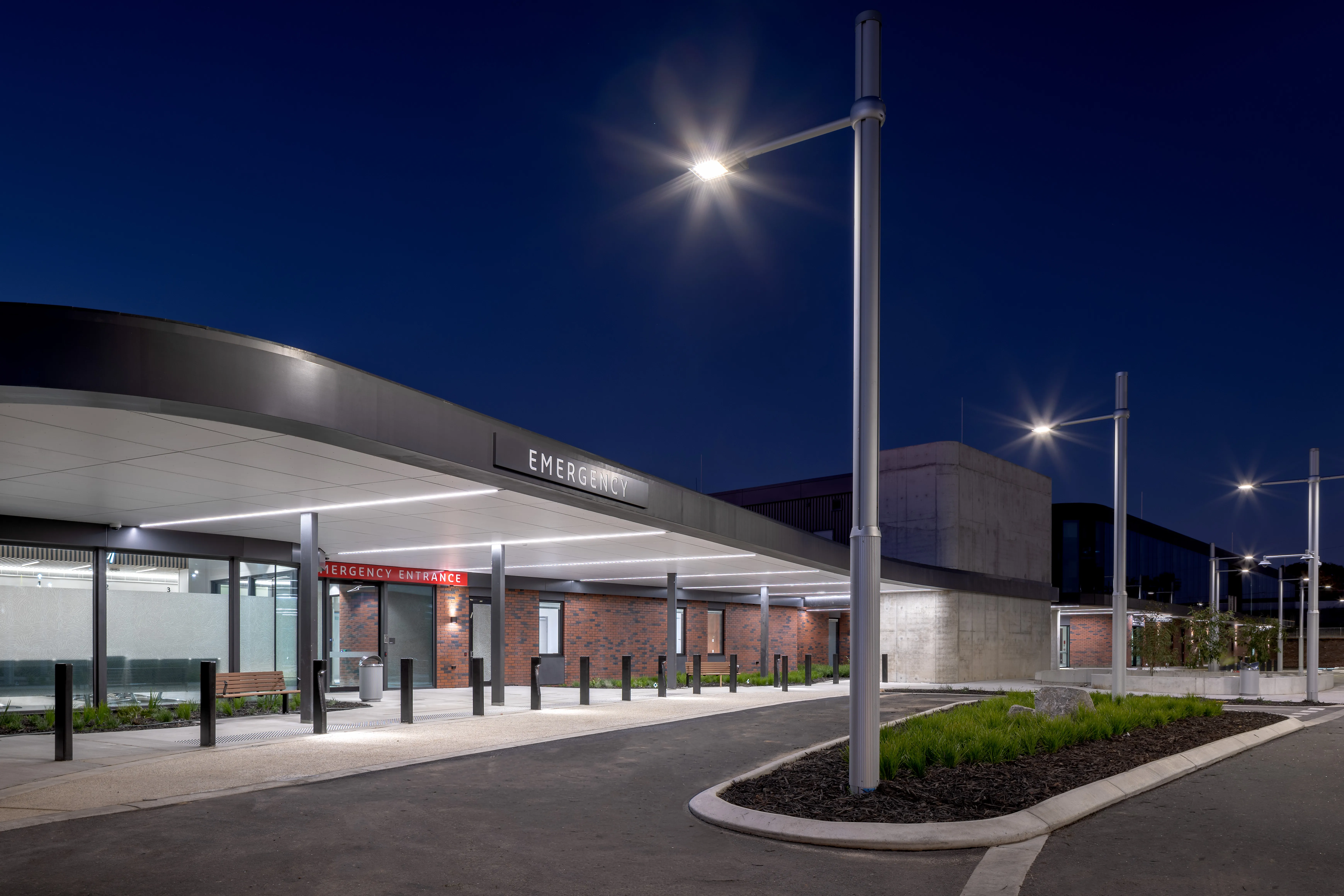 a building with a covered roof and a street light