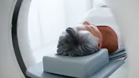 a person lying on a machine