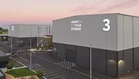 a large building with a parking lot and a parking lot